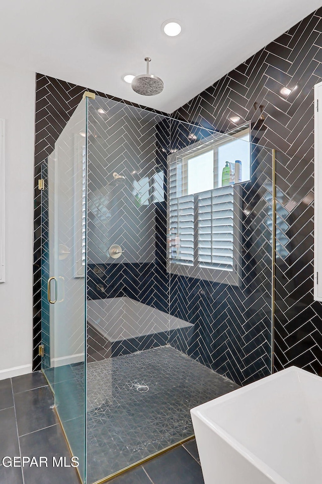6328 Camino Nogal Dr, El Paso, TX 79932 - full bathroom featuring a stall shower, a freestanding bath, tile walls, tile patterned flooring, and recessed lighting