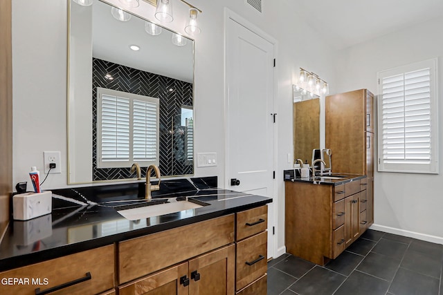 6328 Camino Nogal Dr, El Paso, TX 79932 - bathroom featuring healthy amount of natural light, tile patterned flooring, and two vanities