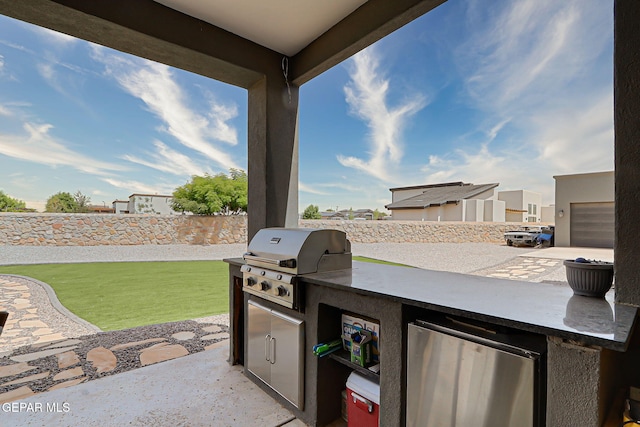 6328 Camino Nogal Dr, El Paso, TX 79932 - fenced backyard with an outdoor kitchen and a patio area