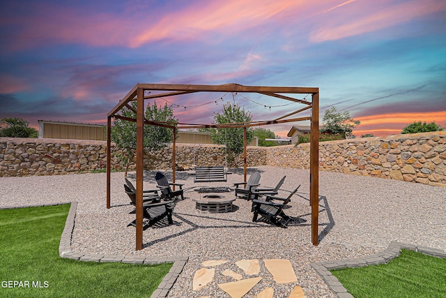 6328 Camino Nogal Dr, El Paso, TX 79932 - patio terrace at dusk featuring a fire pit and a patio area