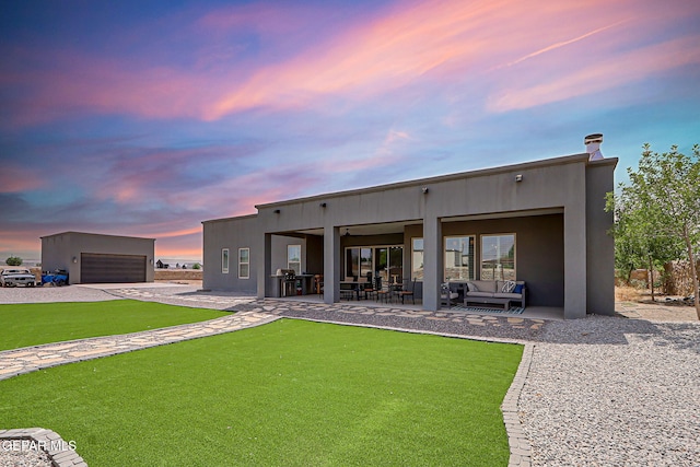 6328 Camino Nogal Dr, El Paso, TX 79932 - back of property with an outdoor living space, a garage, a patio area, and stucco siding
