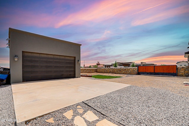 6328 Camino Nogal Dr, El Paso, TX 79932 - view of garage at dusk