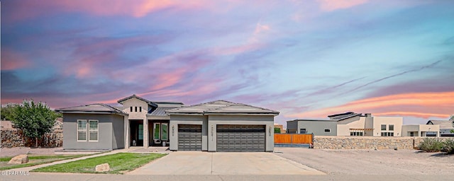 6328 Camino Nogal Dr, El Paso, TX 79932 - view of front of property with an attached garage, driveway, and stucco siding