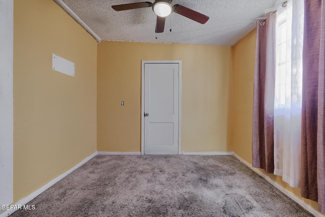 301 Cooley Ave, El Paso, TX 79907 - spare room featuring a textured ceiling, a ceiling fan, and carpet flooring