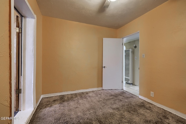 301 Cooley Ave, El Paso, TX 79907 - empty room with a heating unit and light colored carpet