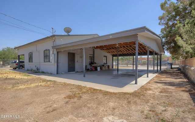301 Cooley Ave, El Paso, TX 79907 - rear view of house featuring a carport and a patio area