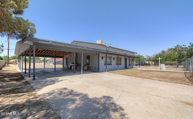 301 Cooley Ave, El Paso, TX 79907 - view of front facade featuring concrete driveway and a carport