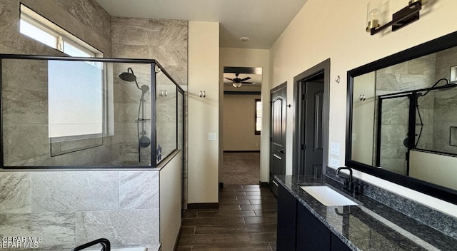 12301 Desert Pine Ave, El Paso, TX 79938 - bathroom featuring a stall shower, plenty of natural light, a ceiling fan, and vanity