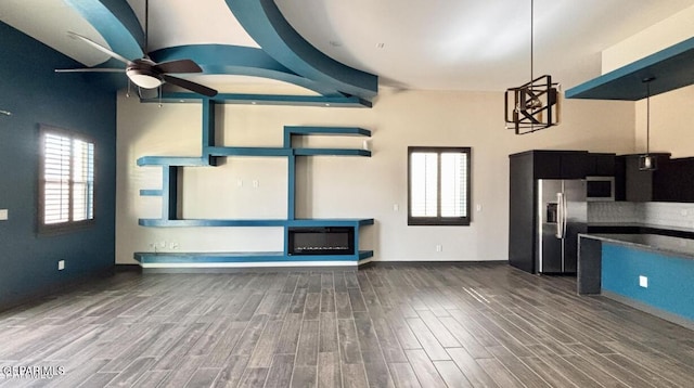 12301 Desert Pine Ave, El Paso, TX 79938 - unfurnished living room with a ceiling fan and wood finished floors