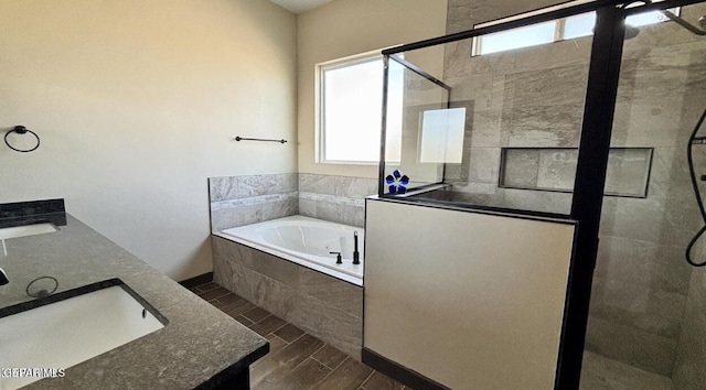 12301 Desert Pine Ave, El Paso, TX 79938 - bathroom with tiled shower, a bath, double vanity, and wood finished floors