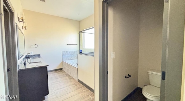 12301 Desert Pine Ave, El Paso, TX 79938 - bathroom featuring wood finished floors, a garden tub, and double vanity