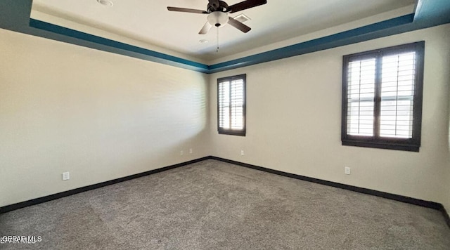 12301 Desert Pine Ave, El Paso, TX 79938 - empty room with a raised ceiling, plenty of natural light, carpet flooring, and ceiling fan