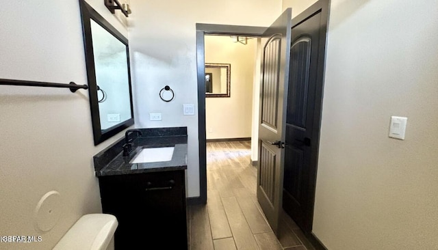 12301 Desert Pine Ave, El Paso, TX 79938 - bathroom with vanity and wood finished floors