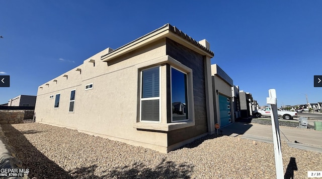 12301 Desert Pine Ave, El Paso, TX 79938 - view of property exterior with stucco siding and a chimney