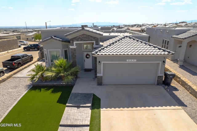 223 Ellesmere Way, El Paso, TX 79928 - view of front facade featuring stone siding, stucco siding, concrete driveway, and a garage