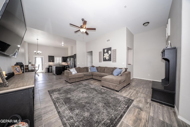 223 Ellesmere Way, El Paso, TX 79928 - living area with a ceiling fan, a chandelier, and wood finished floors