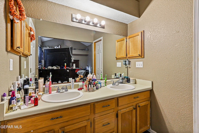 4728 Loma Grande Dr, El Paso, TX 79934 - full bath featuring a textured wall and double vanity