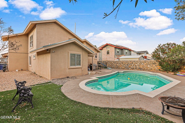 4728 Loma Grande Dr, El Paso, TX 79934 - view of swimming pool with a fire pit, a fenced backyard, and a patio area