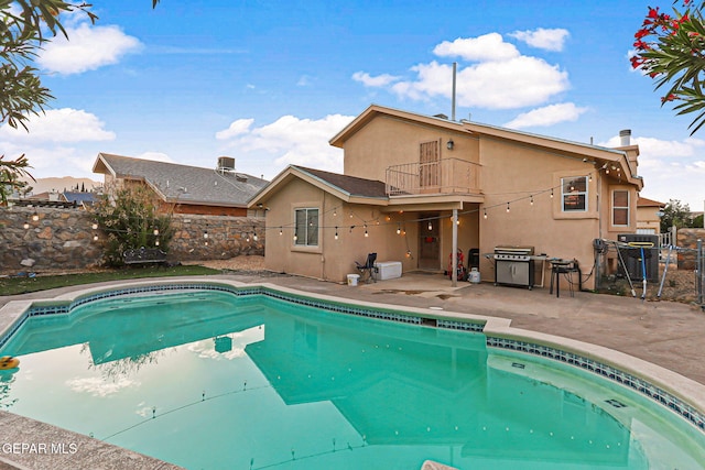 4728 Loma Grande Dr, El Paso, TX 79934 - view of swimming pool with a patio area, a fenced backyard, and area for grilling