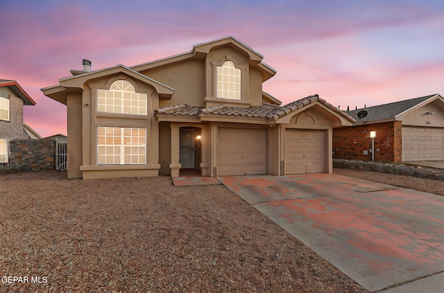 4728 Loma Grande Dr, El Paso, TX 79934 - view of front of home with stucco siding, driveway, a garage, and a tile roof