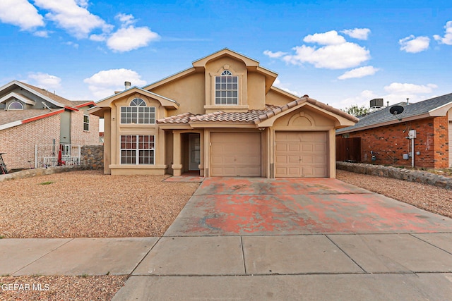 4728 Loma Grande Dr, El Paso, TX 79934 - view of front of home featuring stucco siding, driveway, and a tiled roof