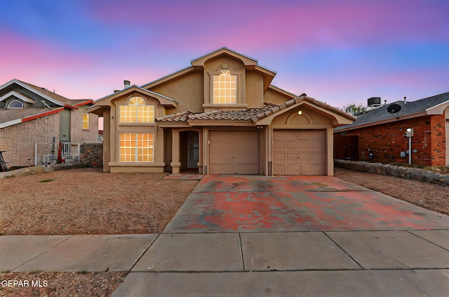 4728 Loma Grande Dr, El Paso, TX 79934 - view of front of property featuring stucco siding, concrete driveway, an attached garage, and a tiled roof