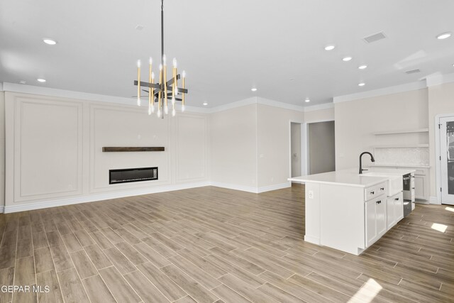 13375 Jeff Winton Dr, El Paso, TX 79928 - kitchen featuring open floor plan, recessed lighting, open shelves, light countertops, and a chandelier