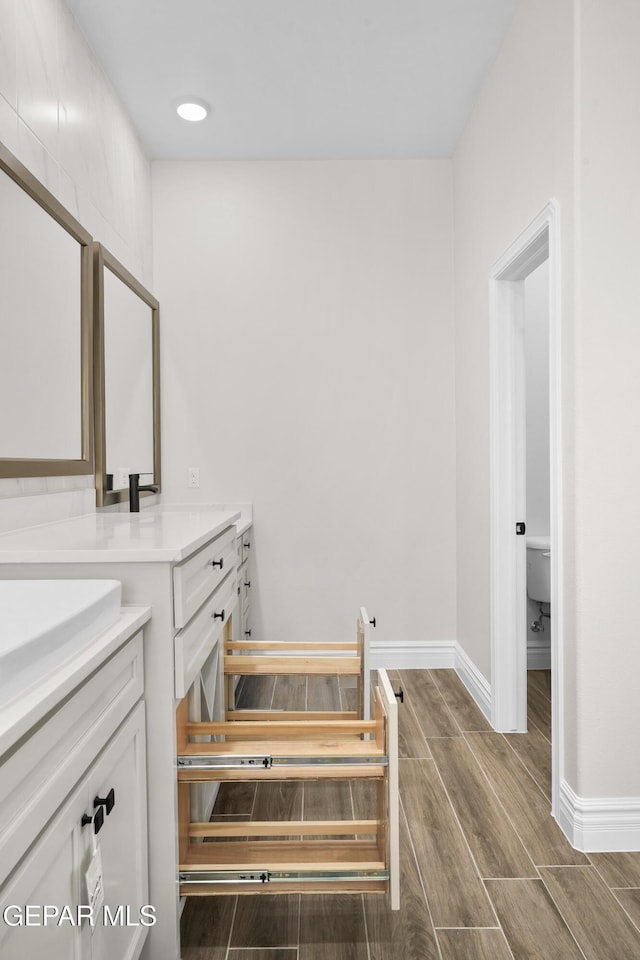13375 Jeff Winton Dr, El Paso, TX 79928 - bathroom featuring vanity and wood tiled floors