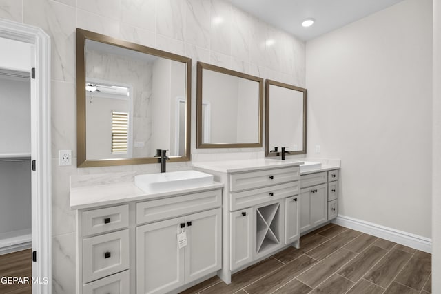 13375 Jeff Winton Dr, El Paso, TX 79928 - full bathroom with double vanity, wood finished floors, and a ceiling fan