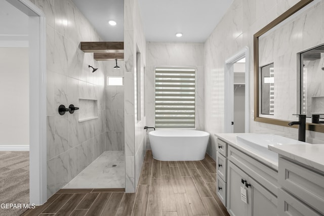 13375 Jeff Winton Dr, El Paso, TX 79928 - full bath featuring wood finish floors, a freestanding bath, vanity, and walk in shower