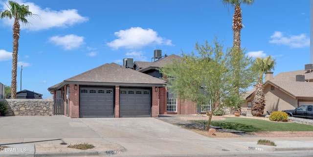 4321 Loma Casitas Rd, El Paso, TX 79934 - view of front of house with a garage, driveway, roof with shingles, and brick siding