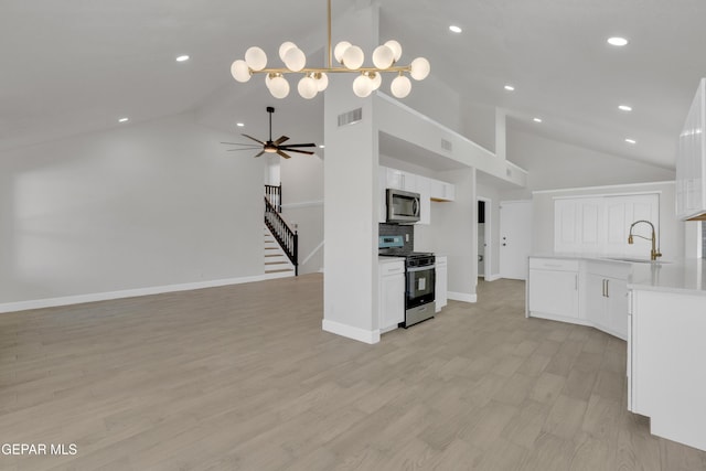 4321 Loma Casitas Rd, El Paso, TX 79934 - kitchen featuring stainless steel appliances, high vaulted ceiling, white cabinetry, light countertops, and a ceiling fan