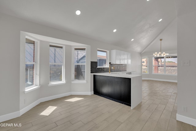 4321 Loma Casitas Rd, El Paso, TX 79934 - kitchen with a chandelier, light countertops, white cabinets, light wood-style flooring, and recessed lighting