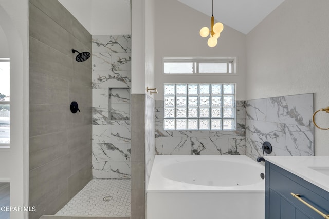 4321 Loma Casitas Rd, El Paso, TX 79934 - full bath featuring a tub with jets, tiled shower, healthy amount of natural light, vanity, and lofted ceiling