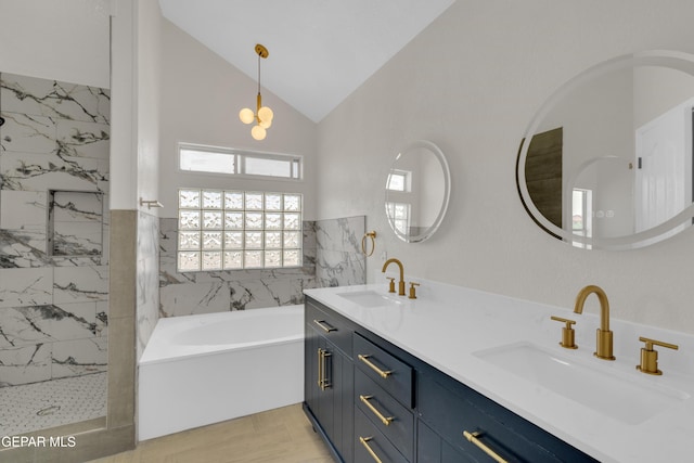 4321 Loma Casitas Rd, El Paso, TX 79934 - bathroom with a bath, double vanity, high vaulted ceiling, a shower, and a chandelier