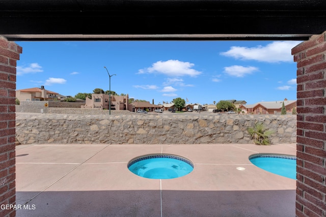 4321 Loma Casitas Rd, El Paso, TX 79934 - view of swimming pool featuring a residential view, an in-ground hot tub, and a patio area