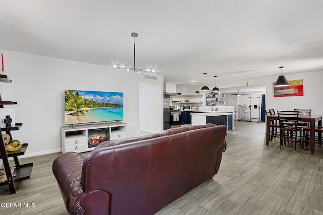 9128 Diana Dr, El Paso, TX 79924 - living room with light wood-style flooring and baseboards