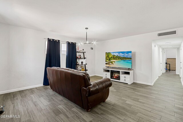 9128 Diana Dr, El Paso, TX 79924 - living area featuring light wood-type flooring and a chandelier