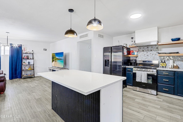 9128 Diana Dr, El Paso, TX 79924 - kitchen with stainless steel gas range, blue cabinetry, open shelves, fridge with ice dispenser, and light wood-style floors