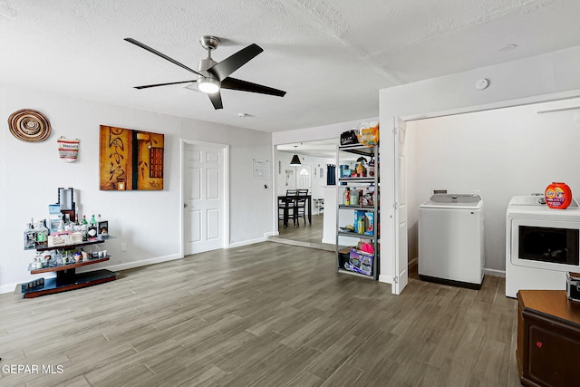 9128 Diana Dr, El Paso, TX 79924 - living area with independent washer and dryer, a ceiling fan, a textured ceiling, and wood finished floors
