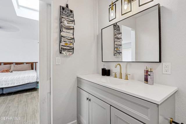 9128 Diana Dr, El Paso, TX 79924 - ensuite bathroom featuring vanity and wood finished floors