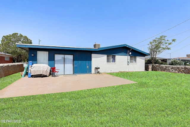 9128 Diana Dr, El Paso, TX 79924 - rear view of house with a patio area, a lawn, and brick siding