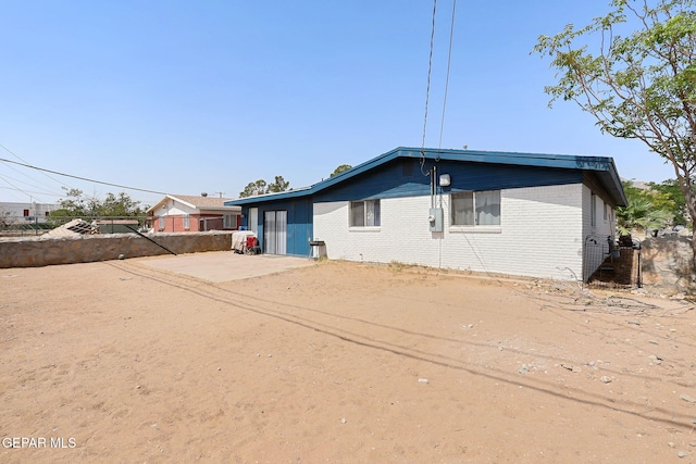 9128 Diana Dr, El Paso, TX 79924 - rear view of property with brick siding and driveway