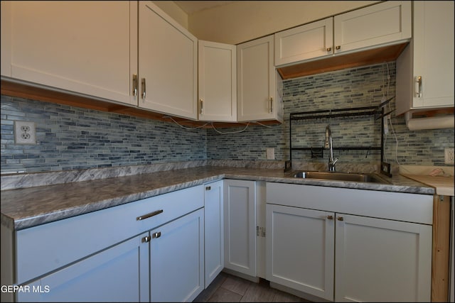 5726 Dearborne Dr, El Paso, TX 79924 - kitchen featuring decorative backsplash and white cabinets