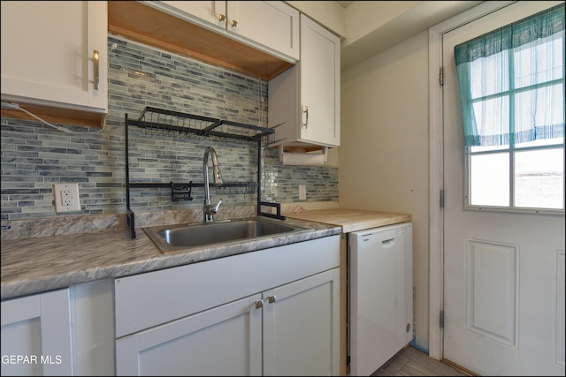 5726 Dearborne Dr, El Paso, TX 79924 - kitchen featuring dishwasher, backsplash, white cabinetry, and light countertops