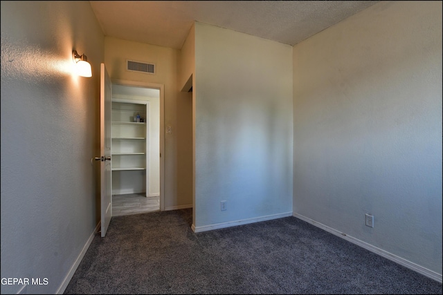 5726 Dearborne Dr, El Paso, TX 79924 - unfurnished room featuring dark colored carpet and baseboards