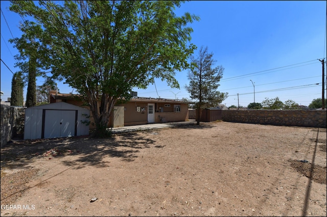 5726 Dearborne Dr, El Paso, TX 79924 - rear view of property featuring a storage unit