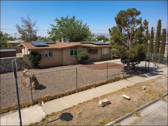 5726 Dearborne Dr, El Paso, TX 79924 - ranch-style house featuring brick siding and roof mounted solar panels
