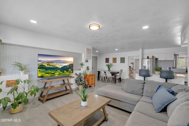 8142 Cook Dr, El Paso, TX 79907 - living room with recessed lighting and an accent wall