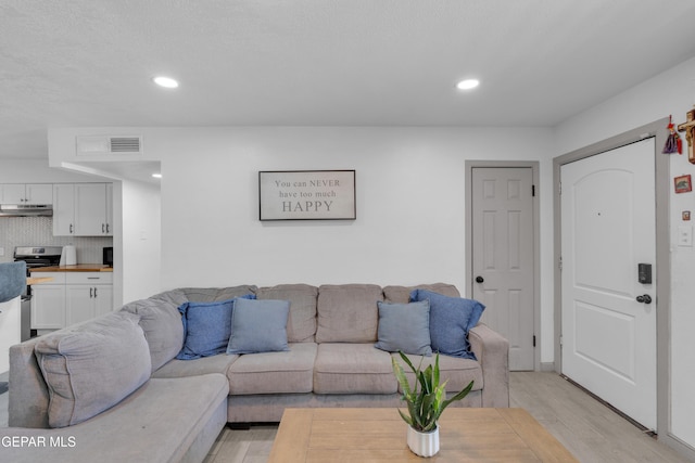 8142 Cook Dr, El Paso, TX 79907 - living area with light wood-style flooring and recessed lighting